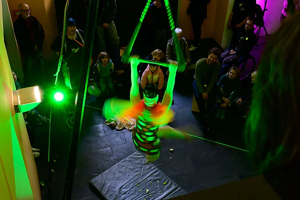 Jana Korb shows the developmental stages of a butterfly on the trapeze