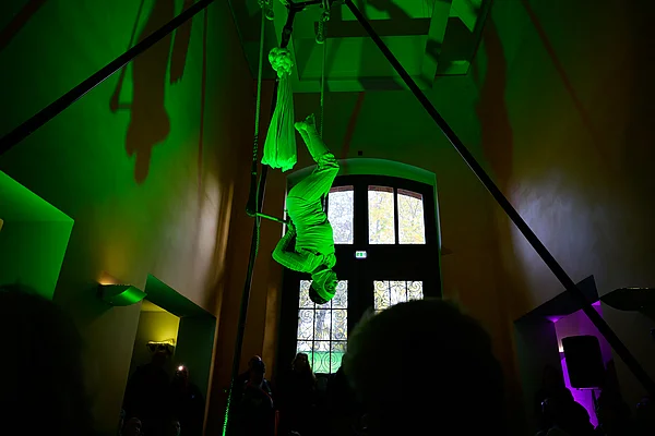 Jana Korb shows the developmental stages of a butterfly on the trapeze